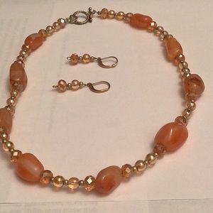 This is a 17 inch long necklace. Matching earrings are 1 and 1/2 inches long.